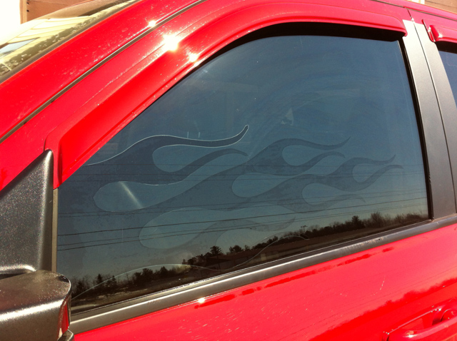 Dodge Ram Flames with professional window tint in North Bay